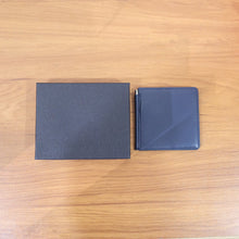 Slim leather-style bi-fold wallet for men in box